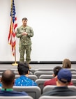 Capt. JD Crinklaw, commander, Puget Sound Naval Shipyard & Intermediate Maintenance Facility, congratulates Employee Resource Group award recipients, Oct. 8, 2024, during the PSNS & IMF ERG awards ceremony in the Shipyard Auditorium, in Bremerton, Washington. (U.S. Navy photo by Wendy Hallmark)