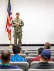 Capt. JD Crinklaw, commander, Puget Sound Naval Shipyard & Intermediate Maintenance Facility, congratulates Employee Resource Group award recipients, Oct. 8, 2024, during the PSNS & IMF ERG awards ceremony in the Shipyard Auditorium, in Bremerton, Washington. (U.S. Navy photo by Wendy Hallmark)