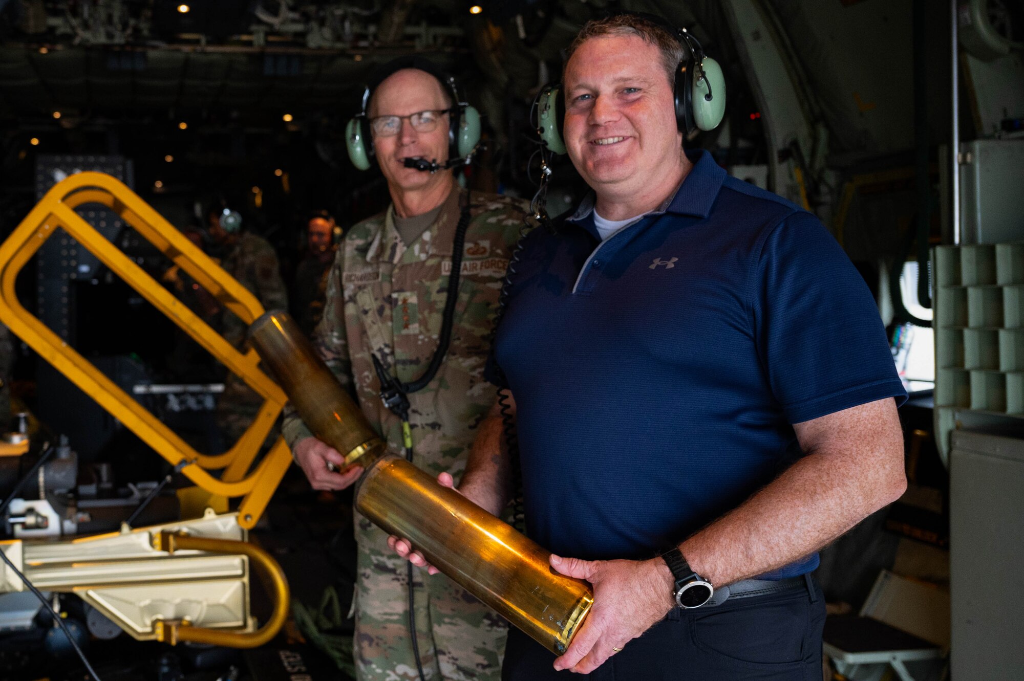 U.S. Air Force Gen. Duke Z. Richardson, commander of Air Force Materiel Command, left, and Honorable Andrew Hunter, Assistant Secretary of the Air Force for Acquisition, Technology and Logistics, hold dispensed 105mm rounds from an AC-130J Ghostrider Gunship at Hurlburt Field, Florida, Oct. 15, 2024.