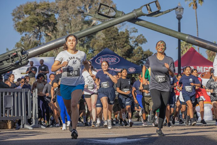 Participants of the 2024 Marine Corps Recruit Depot San Diego Boot Camp Challenge cross the starting line at  at MCRD San Diego, California, Oct. 19, 2024. For the past 23 years, MCRD San Diego has hosted the MCRD San Diego Boot Camp Challenge, a three-mile obstacle course race guided by 60 drill instructors that highlights the physical and mental demands of boot camp. The event fosters comradery and community engagement through interaction with MCRD personnel. (U.S. Marine Corps photo by Cpl. Alexandra M. Earl)