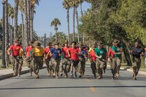 U.S. Marine Corps drill instructors, Recruit Training Regiment, Marine Corps Recruit Depot San Diego, motivate a participant during the 2024 MCRD San Diego Boot Camp Challenge as he approaches the finish line at MCRD San Diego, California, Oct. 19, 2024. For the past 23 years, MCRD San Diego has hosted the MCRD San Diego Boot Camp Challenge, a three-mile obstacle course race guided by 60 drill instructors that highlights the physical and mental demands of boot camp. The event fosters comradery and community engagement through interaction with MCRD personnel. (U.S. Marine Corps photo by Cpl. Alexandra M. Earl)