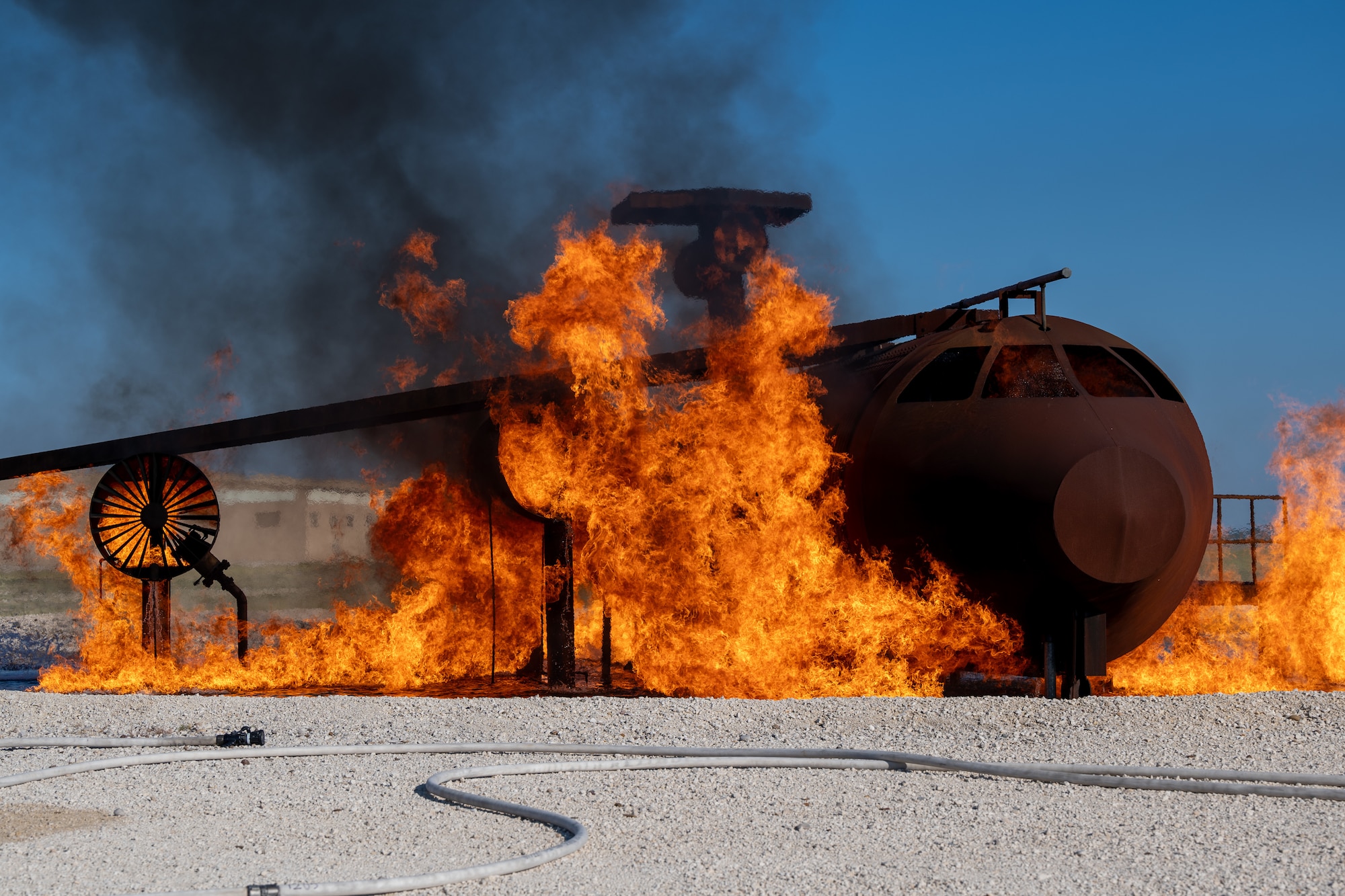 The aircraft live fire simulator completes a burn-off at Laughlin Air Force Base, Texas, Oct. 15, 2024. The burn-off purges excess fuel from the system at the end of training sessions, helping keep the area safe and ready for future use. (U.S. Air Force photo by Staff Sgt. Nicholas Larsen)