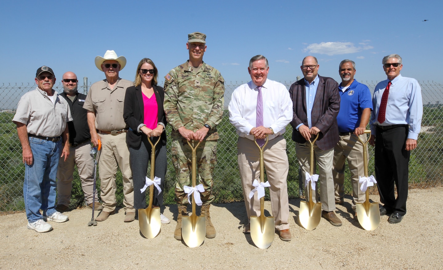 Project partners with the U.S. Army Corps of Engineers Los Angeles District, Riverside County Flood Control and Water Conservation District, City of Norco, California Office of Emergency Services, Riverside County, along with U.S. Rep. Ken Calvert of California’s 41st Congressional District and contractors, stand together Oct. 3 for a photo along the Santa Ana River in Norco, California, before the Upper Norco Bluffs Emergency Repair Project groundbreaking ceremony.