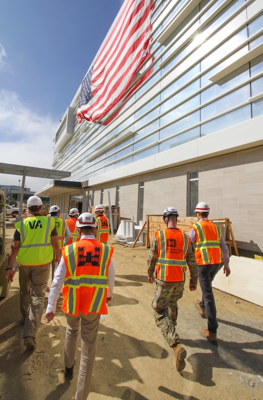 Senior leaders with the U.S. Army Corps of Engineers and Department of Veterans Affairs embark on a tour Oct. 9 at the Jennifer Moreno DVA Medical Center campus in San Diego of the Spinal Cord Injury / Community Living Center, which is scheduled to replace the current facility and open its doors to veterans in 2025.