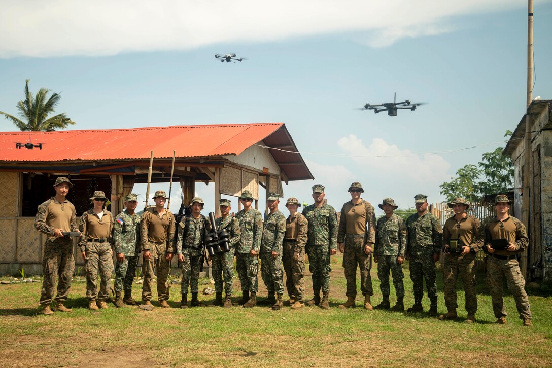 U.S. Marines assigned to the 15th Marine Expeditionary Unit and Philippine Marines assigned to Intelligence Company, 3rd Marine Brigade, pose for a photo during a counter-unmanned aircraft system subject matter expert exchange as part of exercise KAMANDAG 8 at Tarumpitao Point, Palawan Province, Philippines, Oct. 18, 2024. KAMANDAG is an annual Philippine Marine Corps and U.S. Marine Corps-led exercise aimed at enhancing the Armed Forces of the Philippines’ defense and humanitarian capabilities by providing valuable training in combined operations with foreign militaries in the advancement of a Free and Open Indo-Pacific. This year marks the eighth iteration of this exercise and includes participants from the French Armed Forces, Royal Thai Marine Corps, and Indonesian Marine Corps; including continued participation from the Australian Defense Force, British Armed Forces, Japan Ground Self-Defense Force, and Republic of Korea Marine Corps. (U.S. Marine Corps photo by Sgt. Amelia Kang)
