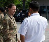 Oregon Air National Guard Maj. Angie Hayes, the bilateral affairs officer, U.S. Embassy Hanoi, speaks with a member of the Vietnamese delegation following the opening ceremony for the 2024 Disaster Management Engagement Activity at Hue University of Education in Hue, Vietnam June, 10, 2024. The Oregon National Guard and Vietnam have been partners since 2012 through the Department of Defense National Guard Bureau State Partnership Program.