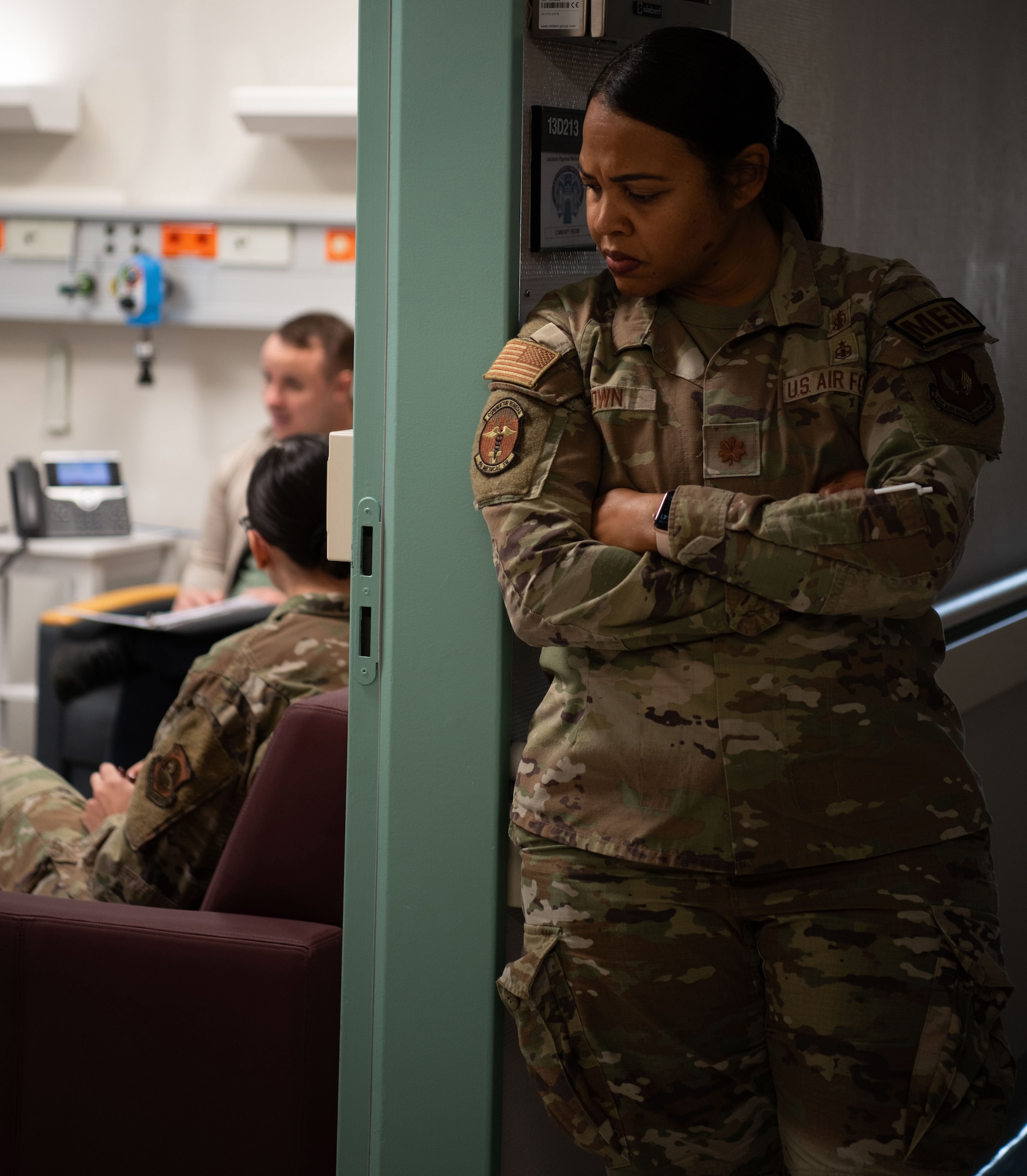 U.S. Air Force Maj. Keshia Brown, 86th Medical Squadron lead nurse, observes a debrief prepared by the reintegration team during the U.S. European Command Phase II Reintegration exercise