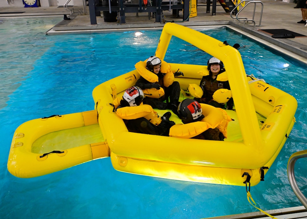 240730-N-BC658-1208 A group of U.S. Naval Sea Cadets wait in a life raft as they recieve an exposure training to what Sailors must endure as part of water survival training from an instructor at Aviation Survival Training Center (ASTC)-Pensacola as part of a first-ever aerospace advanced medical training (AVMT) held from July 28 to August 3. The inaugural AVMT class 2401 received over 32 hours of instruction in International Trauma Life Support (ITLS) curriculum from Search and Rescue (SAR) Flight Medics. Modeled after the Navy’s Flight Medic Course, cadets learned patient assessment, basic and advanced lifesaving interventions, in-flight emergency care, and critical care management to treat patients while on rotary or tilt wing aircraft. Cadets also got a taste of the SAR Fitness Test and what it takes to be a SAR Medical Technician (SMT). The Navy Medicine Operational Training Command (NMOTC) is the Navy’s leader in operational medicine and trains specialty providers for aviation, surface, submarine, expeditionary, and special operations communities. With  five detachments, 12 training centers, and facilities in over 60 locations across the United States, NMOTC provides high impact individual medical training for the Navy, other U.S. armed forces, and allied nations around the globe. (U.S. Navy photo by Mass Communication Specialist 1st Class Russell Lindsey SW/AW)