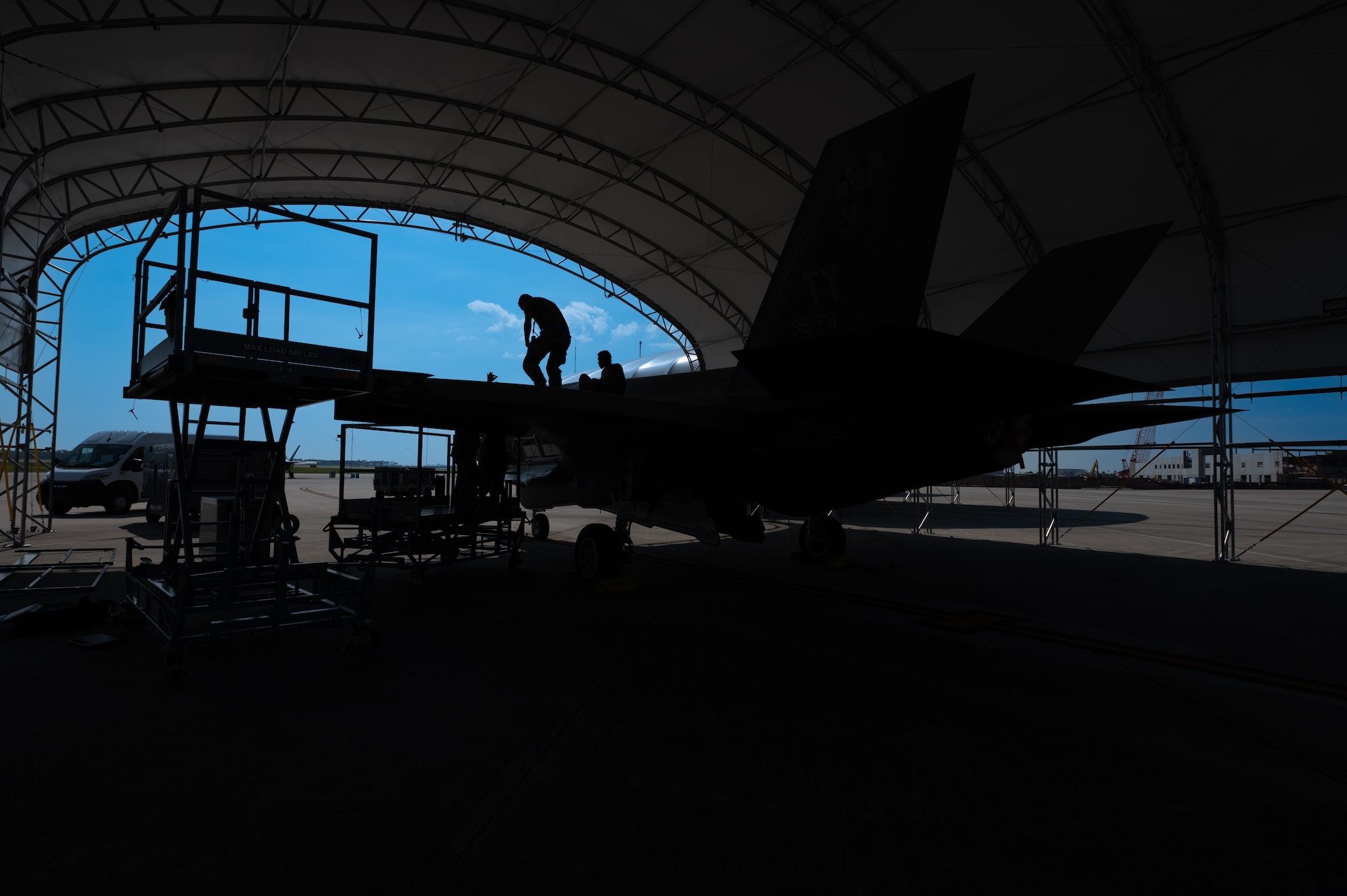 maintainers work on f-35