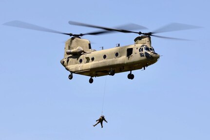 U.S. Soldiers with Bravo Company, 2-104th General Support Aviation Battalion, 28th Expeditionary Combat Aviation Brigade, train hoist operations in a CH-47 Chinook helicopter during annual training at Muir Army Heliport, Fort Indiantown Gap, Pennsylvania, June 28, 2024. (U.S. Army National Guard photo by 1st Lt. Kate Kramer)