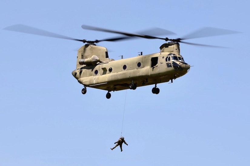 U.S. Soldiers with Bravo Company, 2-104th General Support Aviation Battalion, 28th Expeditionary Combat Aviation Brigade, train hoist operations in a CH-47 Chinook helicopter during annual training at Muir Army Heliport, Fort Indiantown Gap, Pennsylvania, June 28, 2024. (U.S. Army National Guard photo by 1st Lt. Kate Kramer)