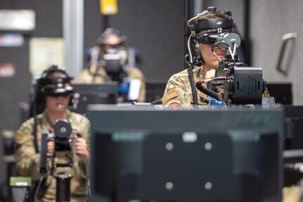 U.S. Air Force Airman 1st Class Adrian Loza-Guzman, a vehicle maintenance apprentice assigned to the 316th Logistics Readiness Squadron, participates in virtual convoy operations training during a bivouac training exercise at Fort Indiantown Gap, Pa., Sept. 4, 2024. The virtual course guided participants through potential real-world scenarios where they reacted to potential threats and improvised explosive devices. (U.S. Air Force photo by Airman 1st Class Daniel Walderbach)