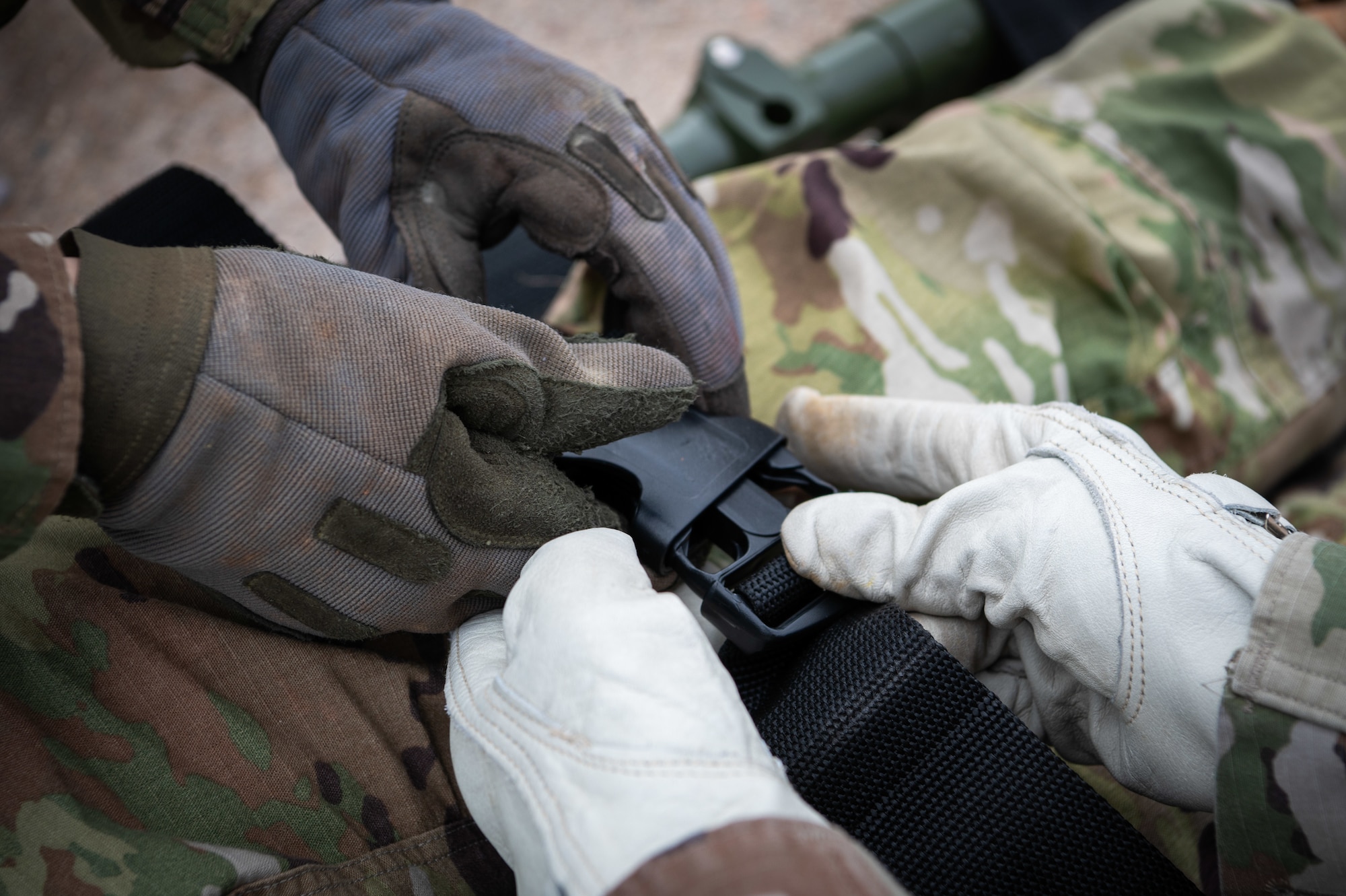 944th Fighter Wing Reserve Citizen Airmen and Arizona Army National Guard personnel secure a simulated patient onto a stretcher during UH-60 Black Hawk helicopter medevac training at Goodyear Phoenix Airport, Goodyear, Ariz., Oct. 19, 2024. The training focused on the coordination and safety protocols necessary for patient transport in austere environments, ahead of Exercise Desert Hammer 25-1 in November. (U.S. Air Force photo by Senior Airman Alexis Orozco)