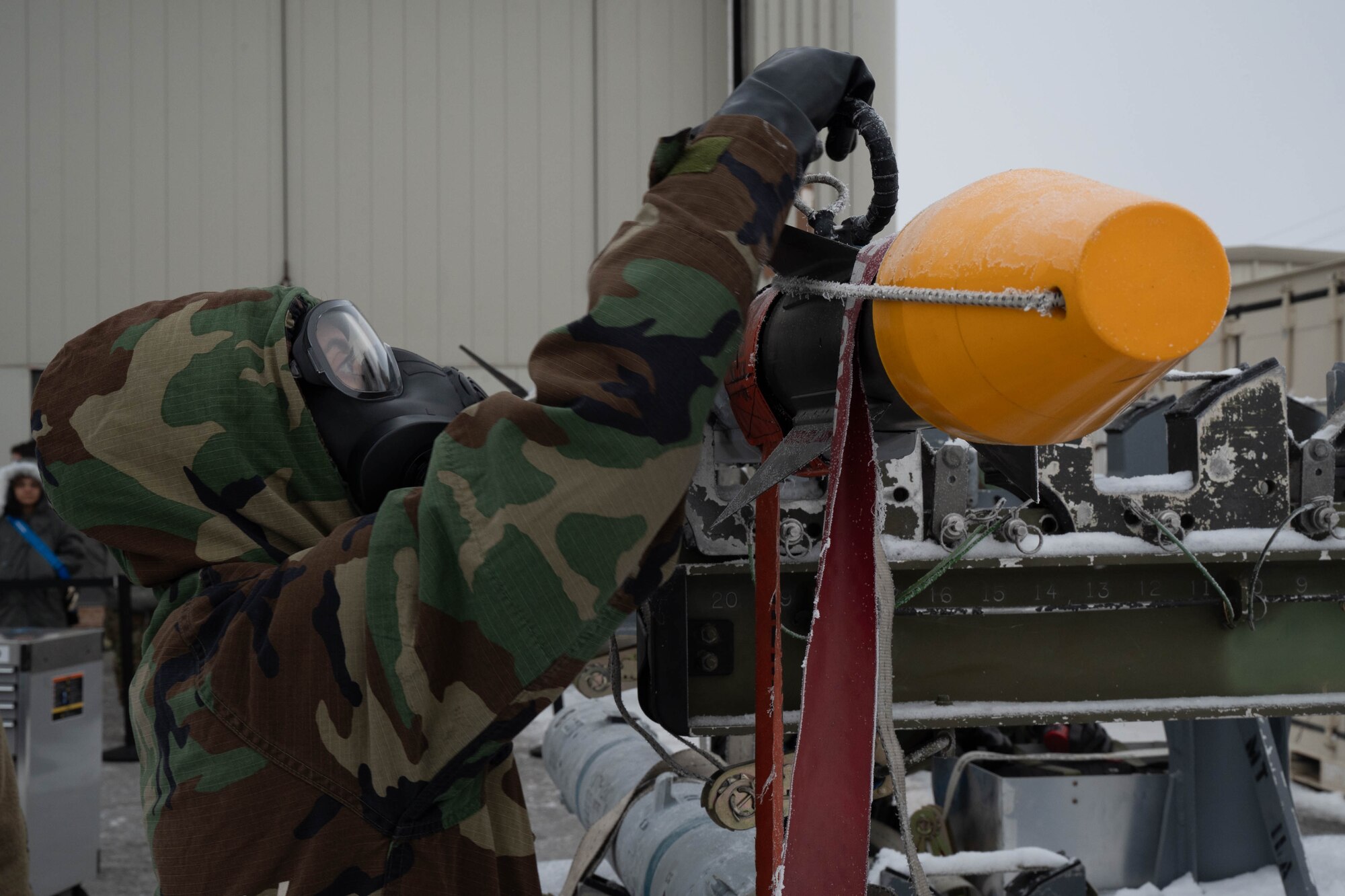 U.S. Air Force Senior Airman Michelle Santos, 18th Fighter Generation Squadron munitions system specialist, prepares an AIM-9X Sidewinder missile during the third quarter load competition at Eielson Air Force Base, Alaska, Oct. 18, 2024.