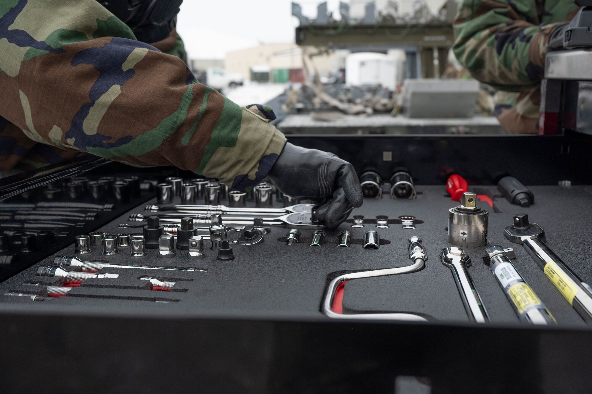 U.S. Air Force Senior Airman Michelle Santos, 18th Fighter Generation Squadron munitions systems specialist, organizes and checks her tool box during the third quarter load competition at Eielson Air Force Base, Alaska, Oct. 18, 2024.