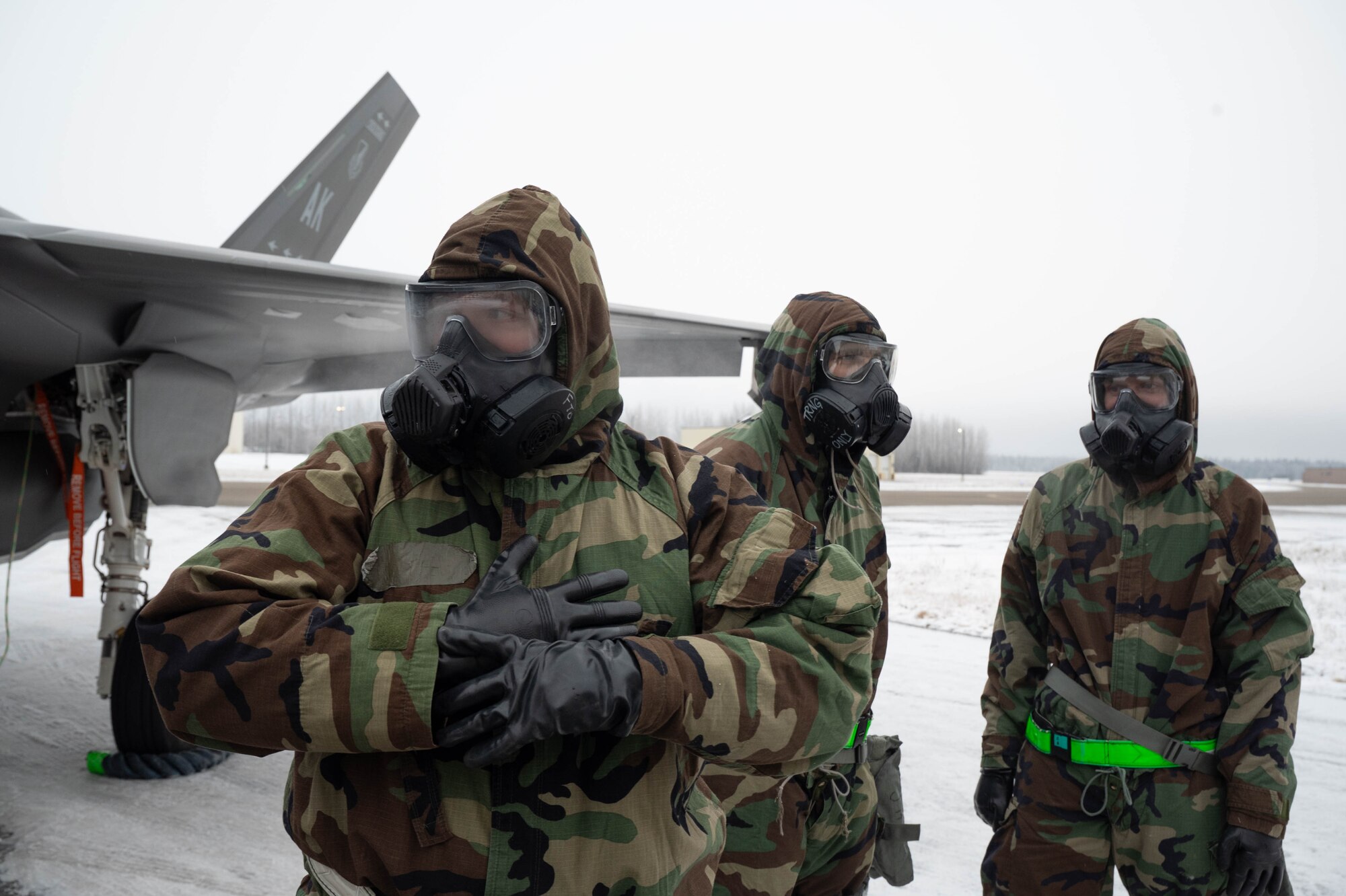 U.S. Airmen from the 356th Fighter Generation Squadron stand by after finishing the third quarter load competition at Eielson Air Force Base, Alaska, Oct. 18, 2024.