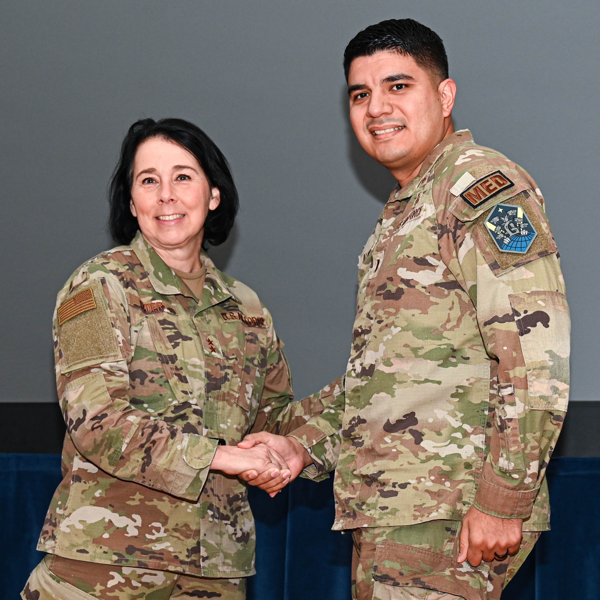 Service members attend a Town Hall event.