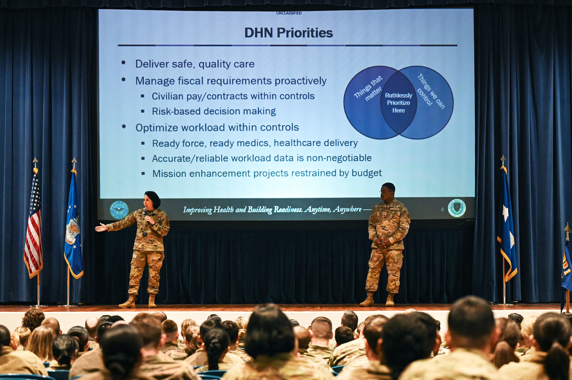 Service members attend a Town Hall event.