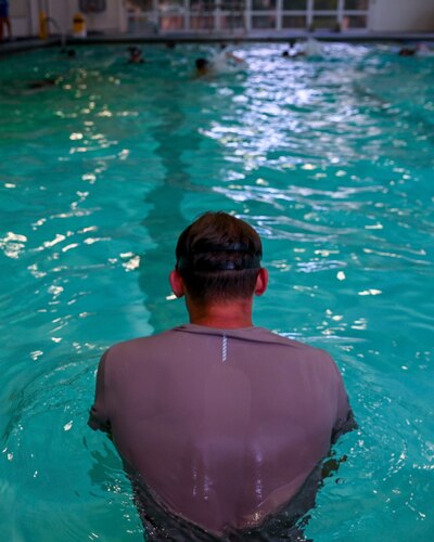 U.S. Air Force Reserve Officer Training Corps cadets from eleven universities swim back during “underwaters” during the Pool Academics of the Special Warfare Air Force Reserve Officer Training Corp Weekend at Ben Kelly Center for Human Performance pool, Angelo State University, San Angelo, Texas, Oct. 19, 2024. Cadets competed in events that tested their readiness knowledge, problem-solving skills, physical fitness, communication, memorization, land navigation, medical evacuation and mental capabilities under stressed conditions. (U.S. Air Force photo by Airman 1st Class Evelyn J. D’Errico)