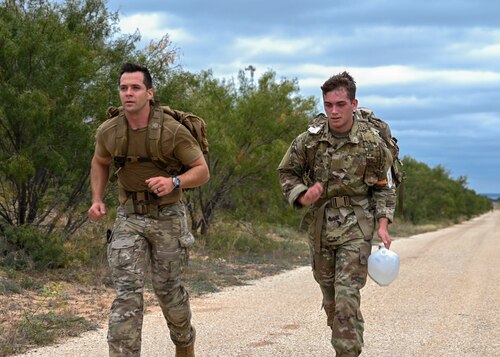 U.S. Air Force Capt. Todd Duquette, 10th Air Support Operations Squadron Tactical Air Control Party Officer, runs with a cadet on the Goodfellow Perimeter Trail during Special Warfare Air Force Reserve Officer Training Corps Weekend, Goodfellow Air Force Base, Texas, Oct. 19, 2024. Cadets competed in events that tested their readiness knowledge, problem-solving skills, physical fitness, communication, memorization, land navigation, medical evacuation and mental capabilities under stressed conditions. (U.S. Air Force photo by Airman 1st Class Evelyn J. D’Errico)