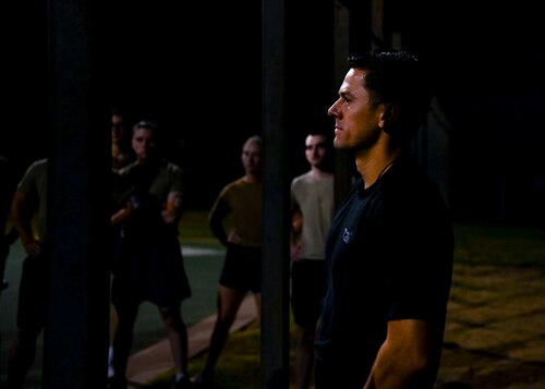 Jordan Smith, T3i Special Warfare Field Developer coach, observes as 38 U.S. Air Force Reserve Officer Training Corps cadets do pull-ups during the Special Warfare Air Force Reserve Officer Training Corps Weekend at the Mathis Gym, Goodfellow Air Force Base, Texas, Oct. 19, 2024. Cadets competed in events that tested their readiness knowledge, problem-solving skills, physical fitness, communication, memorization, land navigation, medical evacuation and mental capabilities under stressed conditions. (U.S. Air Force photo by Airman 1st Class Evelyn J. D’Errico)