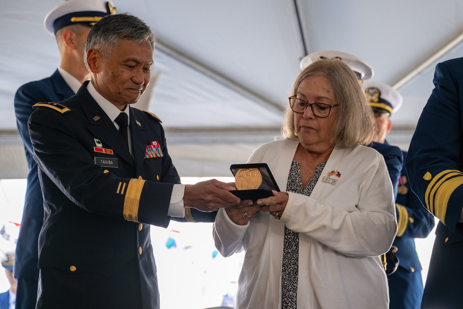 Retired U.S. Army Maj. Gen. Antonio Taguba presents the Congressional Gold Medal to Elizabeth “Betty” Murphy, the daughter of Florence Finch, during the commissioning ceremony for U.S. Coast Guard Cutter Florence Finch