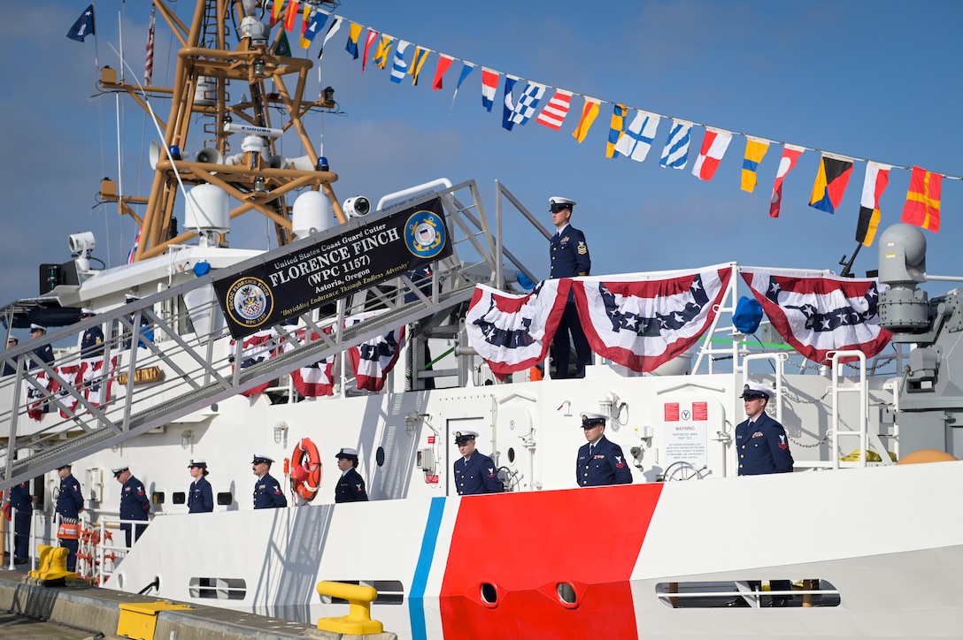 Crew members from Coast Guard Cutter Florence Finch (WPC 1157) stand at attention during the commissioning for the cutter held in Seattle