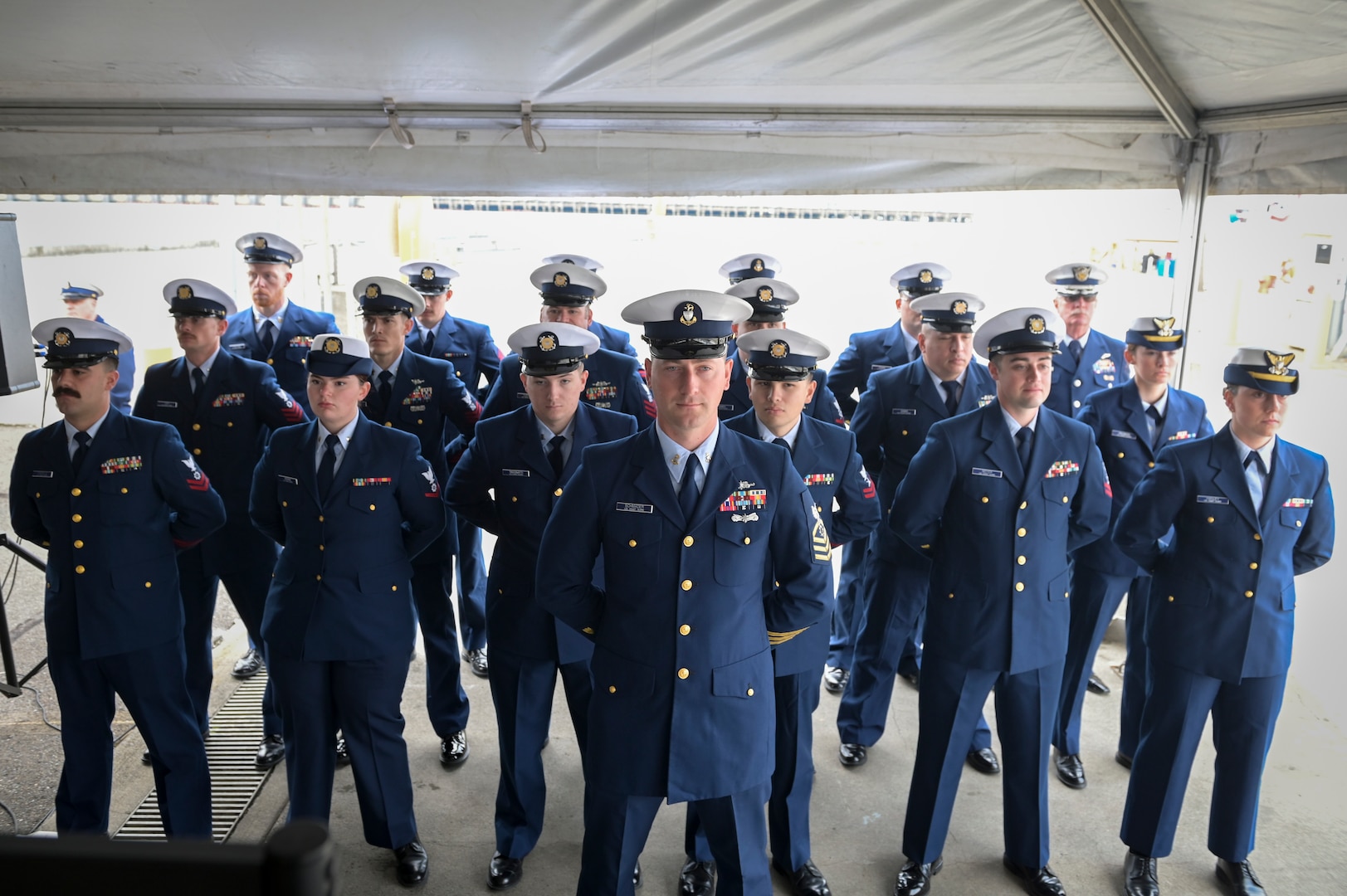 Crew members from Coast Guard Cutter Florence Finch (WPC 1157) stand at attention during the commissioning for the cutter held in Seattle