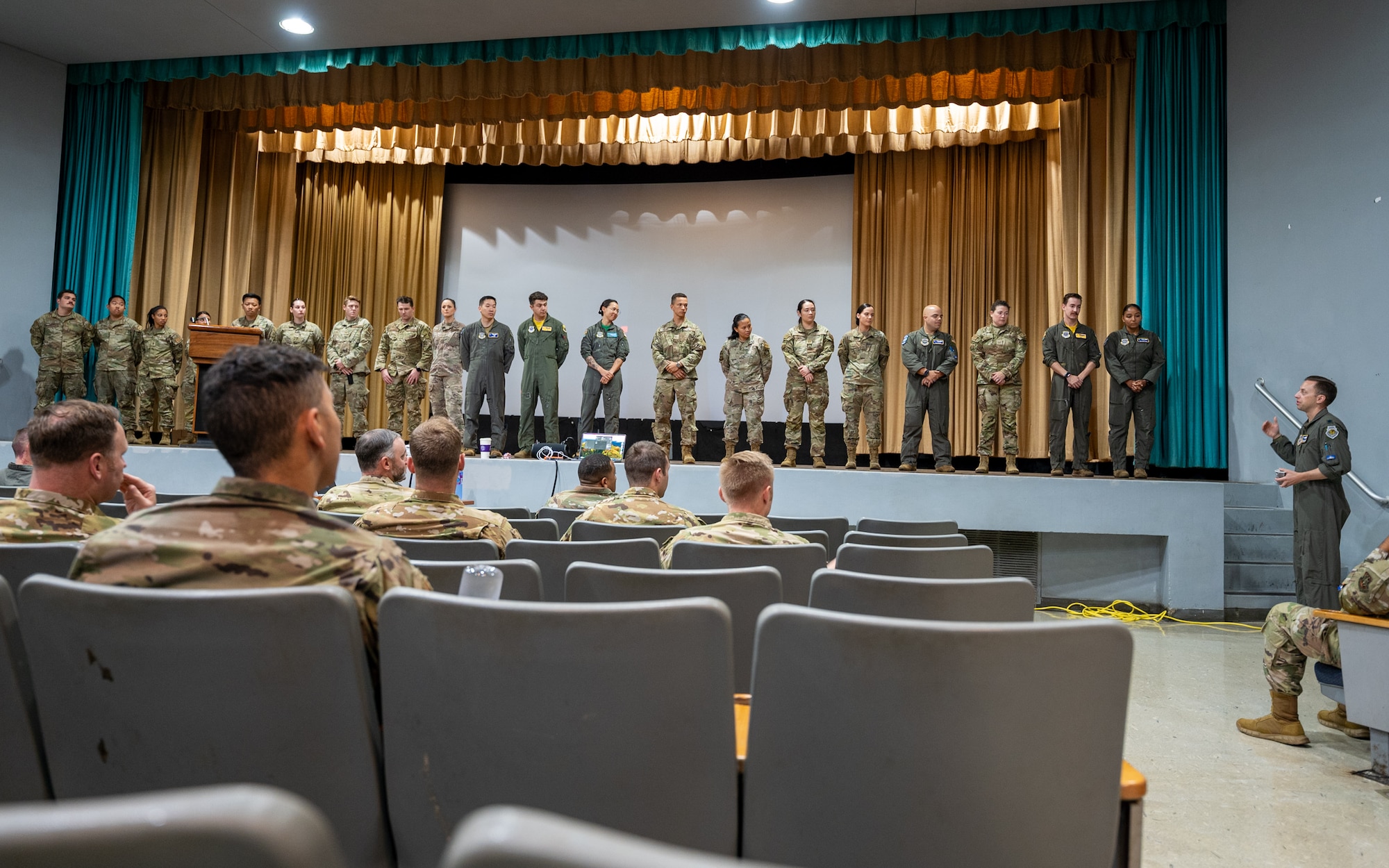 U.S. Air Force Lt. Col. Matthew Weinberg, 7th Expeditionary Airlift Squadron commander, recognizes specific star performers during Rainier War 25A at Joint Base Pearl Harbor-Hickam, Hawaii, Oct. 18, 2024.