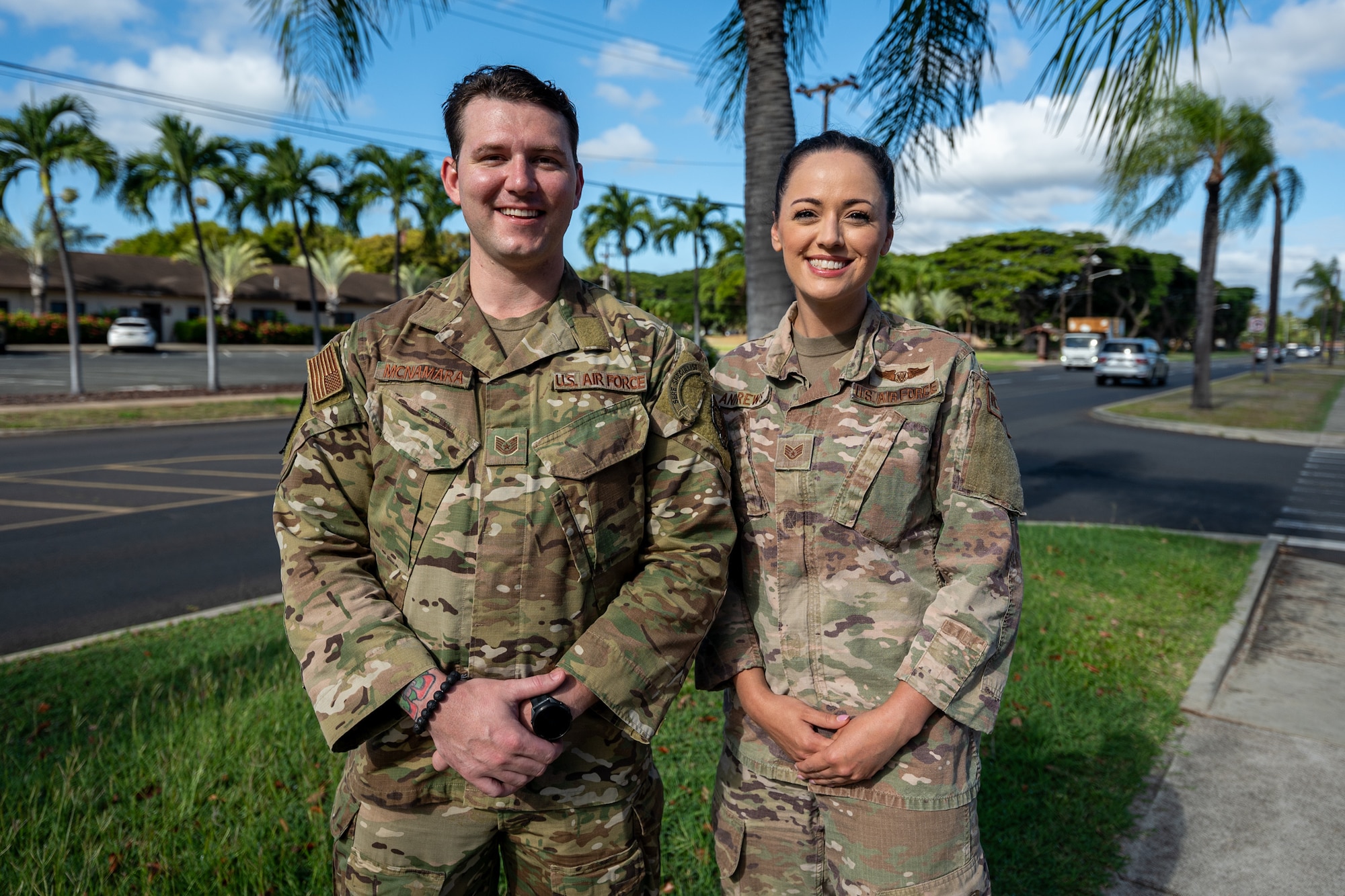 U.S. Air Force Tech. Sgt. Kyle McNamara, 62d Operations Support Squadron Survival Evasion Resistance and Escape operations noncommissioned officer in charge, left, and Staff Sgt. Cori Andrews, 62d Medical Squadron independent duty medical technician, stand together at Joint Base Pearl Harbor-Hickam, Hawaii, Oct. 18, 2024.