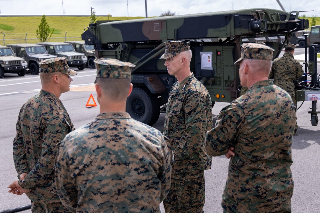 U.S. Marine Corps Sgt. Mason Fuller, left, a field artillery radar operator with 12th Marine Littoral Regiment, 3d Marine Division, speaks on the importance of deploying AN/TPS-80 Ground/Air Task Oriented Radars with Lt. Gen. James Glynn, center, commanding general of Marine Forces Pacific, and Lt. Gen. Roger B. Turner, right, commanding general of III Marine Expeditionary Force, during exercise Keen Sword 25 at Japan Ground Self-Defense Force Camp Ishigaki, Okinawa, Japan, Oct. 23, 2024. KS25 is a biennial, joint and bilateral field-training exercise involving U.S. military and Japan Self-Defense Force personnel, designed to increase readiness and interoperability while strengthening the ironclad U.S.-Japan alliance. Fuller is a native of Utah. (U.S. Marine Corps photo by Staff Sgt. JVonnta Taylor)