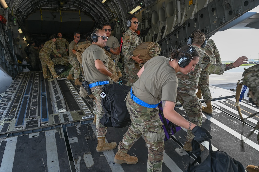 The 734th Air Mobility Squadron Airmen picks up and transfer cargo at Andersen Air Force Base, Guam, Oct. 23, 2024, during Slingstone 24-4.