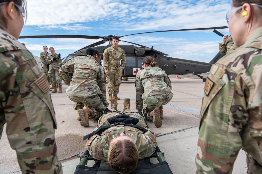 944th Fighter Wing Reserve Citizen Airmen and Arizona Army National Guard personnel prepare to transport a simulated patient during medevac training at Goodyear Phoenix Airport, Goodyear, Ariz., Oct. 19, 2024. The joint training is a critical step in preparing for Exercise Desert Hammer 25-1 in November. (U.S. Air Force photo by Senior Airman Alexis Orozco)