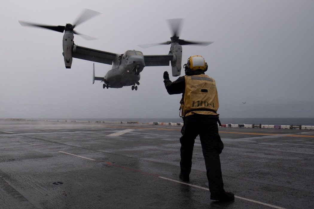 A U.S. Marine Corps MV-22B Osprey, attached to Marine Medium Tiltrotor Squadron (VMM) 165 (Reinforced), 15th Marine Expeditionary Unit (MEU), prepares to land on the flight deck aboard the Wasp-class amphibious assault ship USS Boxer (LHD 4) while the ship steams in the Sulu Sea, Oct. 22, 2024.