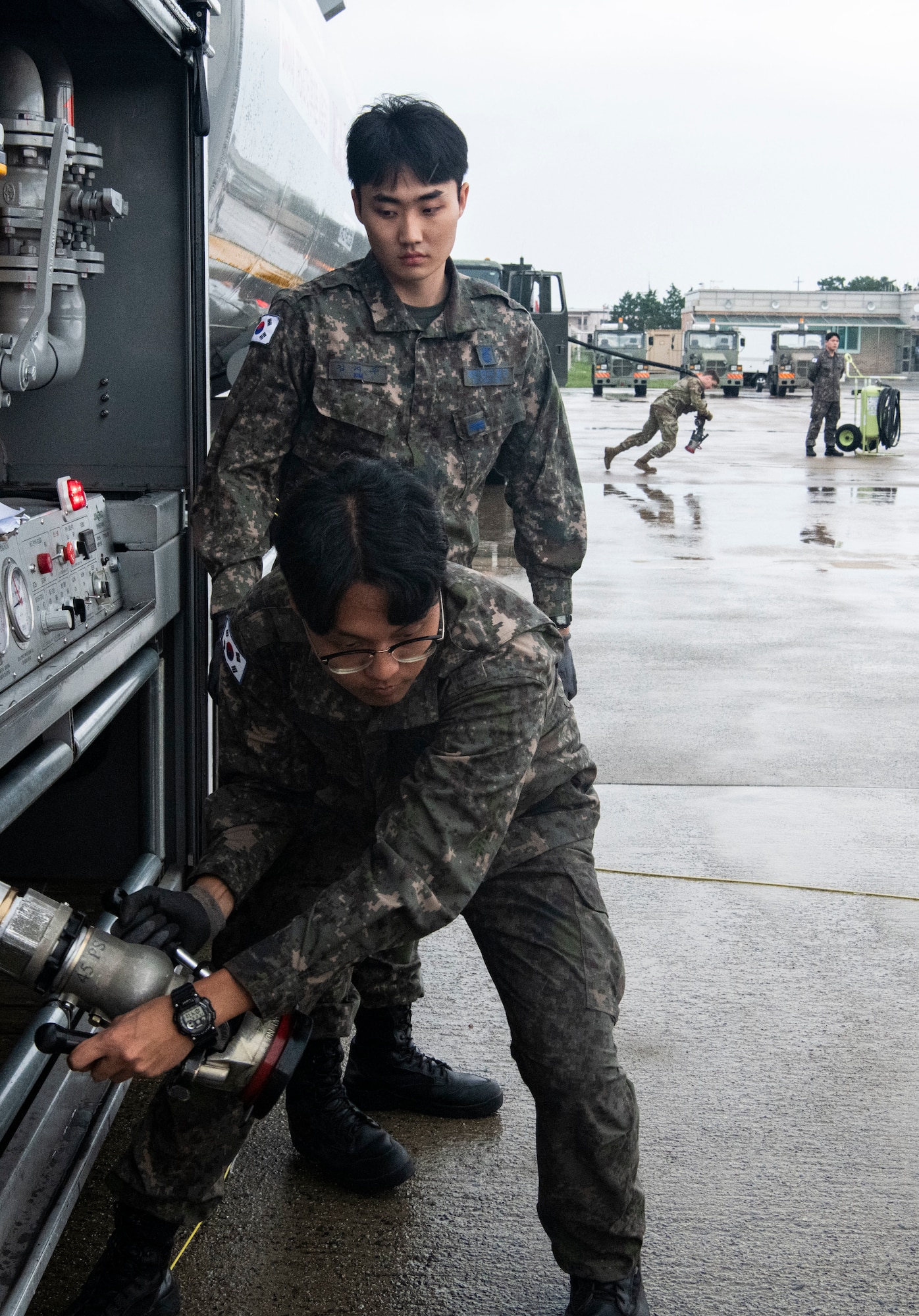 KUNSAN AIR BASE, Republic of Korea -- Republic of Korea Air Force and United States Air Force Airmen pose for a photo at the end of the ROK-US cross servicing demonstration.