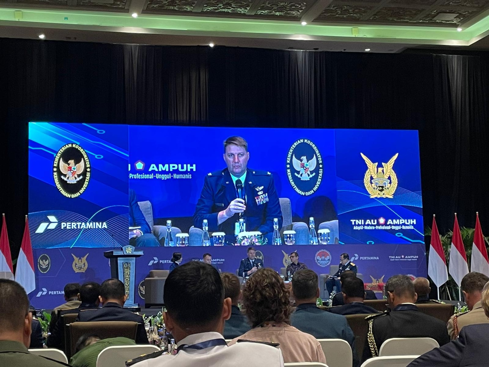Photo of U.S. Air Force colonel speaking at a forum.
