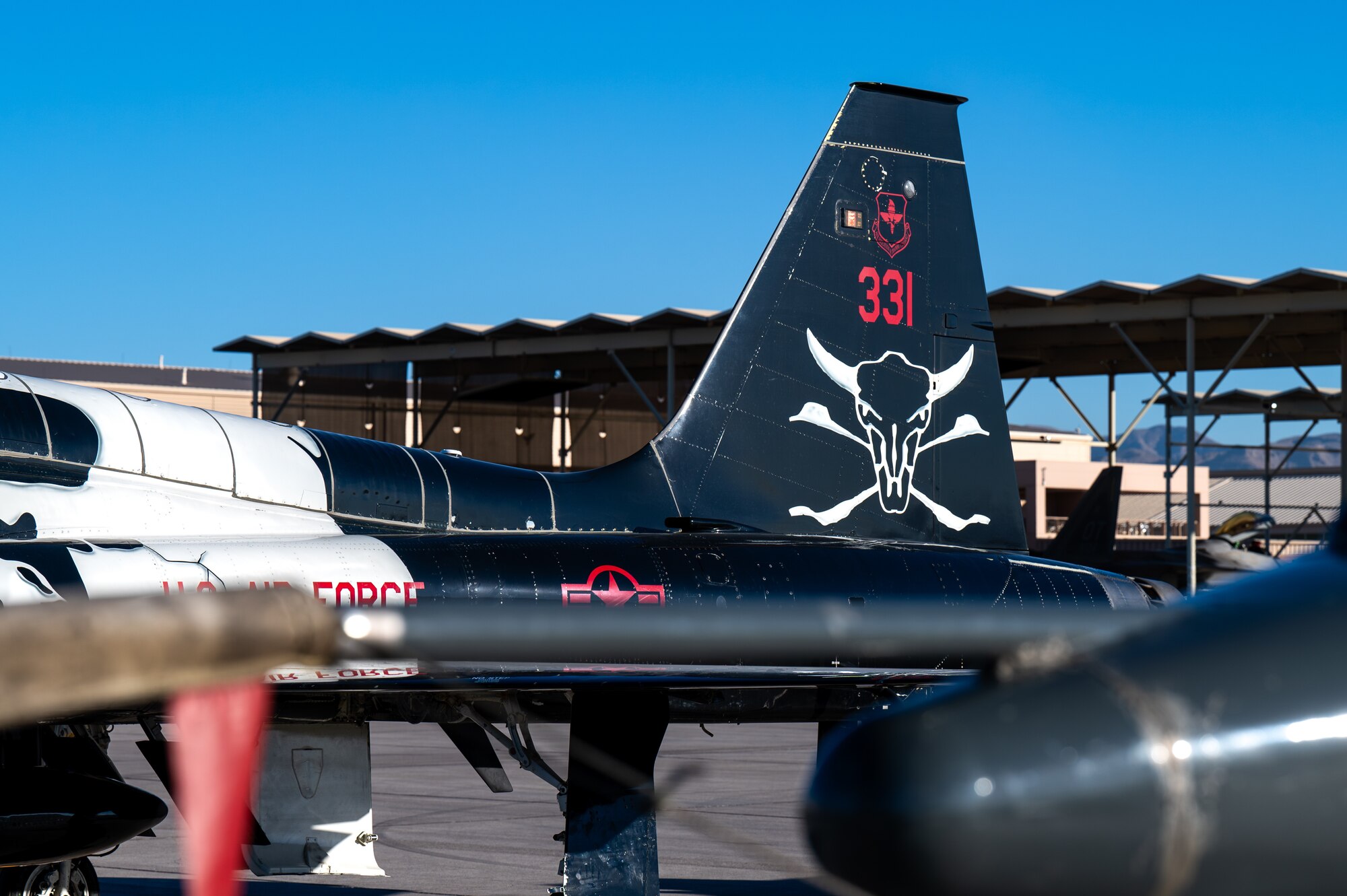 A U.S. Air Force T-38 Talon assigned to the 87th Flying Training Squadron (FTS), Laughlin Air Force Base (AFB), Texas, sits on the flightline at Nellis AFB, Nevada, Sept. 27, 2024. The 87th FTS sent 10 T-38 Talons to Nellis AFB to provide Weapons Instructor Course support for the 6th and 433rd Weapons Squadrons. (U.S. Air Force photo by Airman 1st Class Brianna Vetro)
