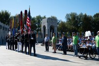 Members of a Joint Service Color Guard at Honor Flight Chicago’s Day of Honor present the colors at the World War II Memorial in Washington, D.C., Oct. 23, 2024. The Joint Service Color Guard consists of national capital region service members from each branch of the U.S. military. The Air Force, Space Force and Navy members of the Joint Service Color Guard are assigned to Joint Base Anacostia-Bolling. (U.S. Air Force photo by Hayden Hallman)