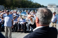 Richard Pasciuto, a volunteer with Bugles Across America, plays taps for Honor Flight Chicago’s Day of Honor during a Joint Service Color Guard posting of the colors at the World War II Memorial in Washington, D.C., Oct. 23, 2024. Pasciuto has provided taps for Honor Flight Chicago for three years. (U.S. Air Force photo by Hayden Hallman)
