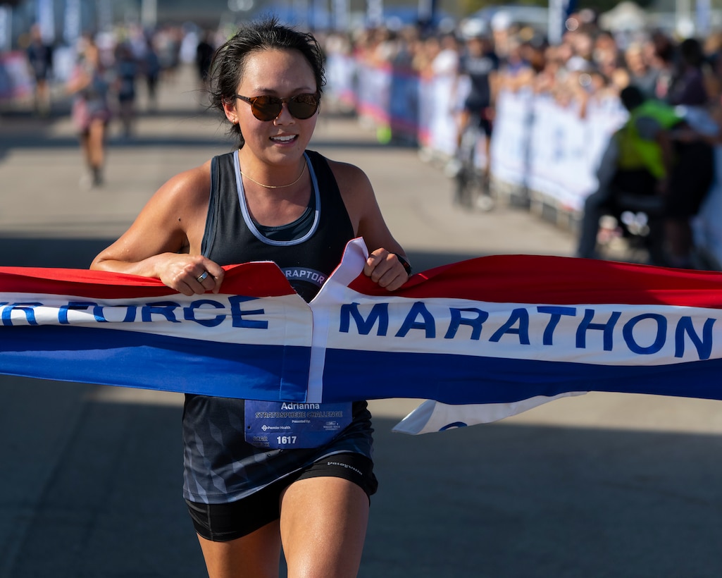 Maj. Adrianna Dong crosses the finish line to win the Women’s Air Force Marathon Sept. 21, 2024 at Wright-Patterson Air Force Base, Ohio. Dong, stationed at Robins Air Force Base, Georgia, finished with a time of 3:13:31. (U.S. Air Force photo by R.J. Oriez)