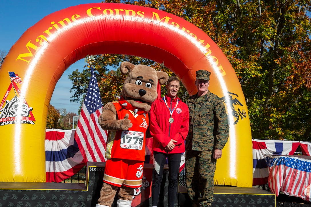 U.S. Marine Corps Capt. Kyle King, assistant operations officer, 3rd Battalion, 11th Marines, 1st Marine Division, poses with his medal after earning first place in the 47th Marine Corps Marathon Men's Division in Arlington, Virginia, Oct. 30, 2022. Runners participated in the marathon not only to support the Marine Corps and their country, but to have the unique experience of running on an iconic course with the Marines after months of commitment and dedication to training for a lifetime goal. (U.S. Marine Corps photo by Lance Cpl. Keegan Bailey)