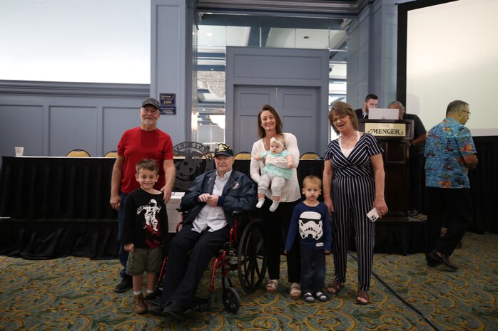 World War II veteran Leighton Wilhite poses with his family at the 74th annual 5th Marine Division reunion on October 17, 2024, in San Antonio, Texas. Veterans of 5th MARDIV gather every year to share stories and continue conversation of their legacy. 5th MARDIV has activated twice in history; first for service in WWII and last for reinforcement of the Vietnam War. (U.S. Marine Corps photo by Staff Sgt. Ryanne Williams)