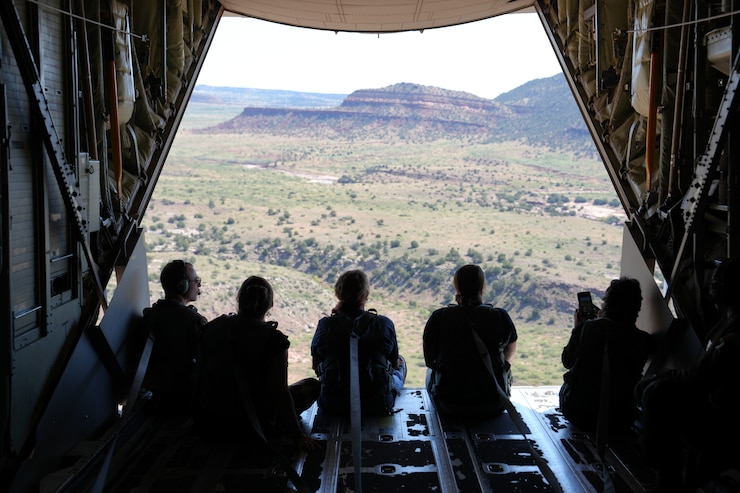 Cannon Air Force Base local educators sit on the ramp of an MC-130J during a flight scheduled for Teachers Understanding Deployment Operations Day over New Mexico, Sept. 28, 2024. The flight provided educators with a firsthand experience of traveling in a military aircraft, helping them understand the physical and emotional toll experienced by deployed service members. (U.S. Air Force photo by Airman 1st Class Gracelyn Hess)