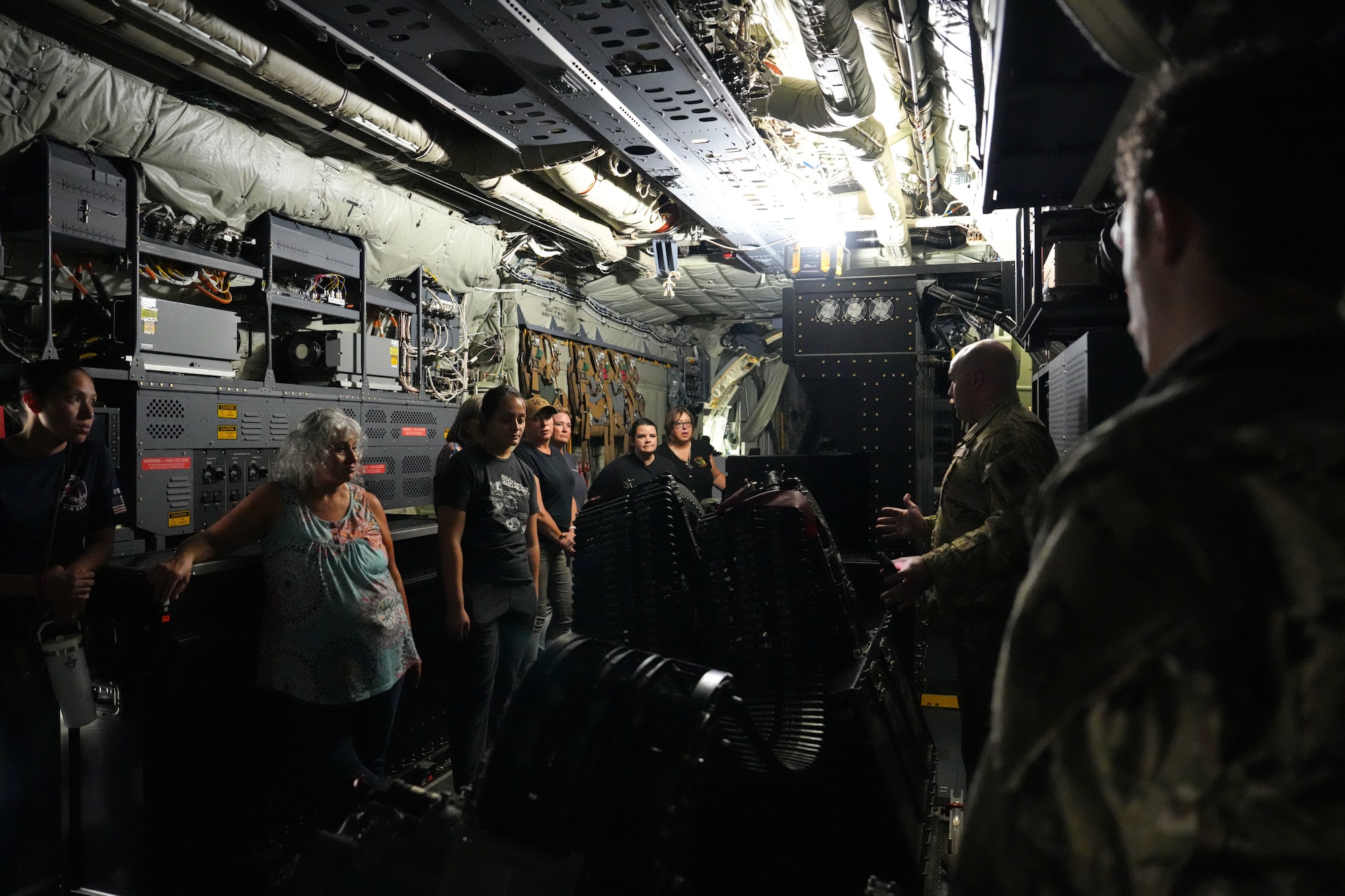 Air Commandos from the 16th Special Operations Squadron discuss the abilities and operations of the AC-130J with local educators at Cannon Air Force Base, New Mexico, Sept. 28, 2024. By providing insights into the unique challenges military youth face—such as frequent relocations, parental deployments, and emotional stress— Teachers Understanding Deployment Operations aims to foster a more understanding and supportive educational environment. (U.S. Air Force photo by Airman 1st Class Gracelyn Hess)