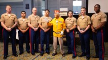 Navajo Code Talker Thomas Begay poses with Marines from 4th Reconnaissance Battalion during the 74th annual 5th Marine Division reunion on October 19, 2024 in San Antonio, Texas. Mr. Begay is one of two remaining original Navajo Code Talkers that served during World War II. He was joined by many other WWII and Vietnam veterans at their annual reunion honoring all Marines who served under 5th MARDIV. (U.S. Marine Corps photo by Staff Sgt. Ryanne Williams)