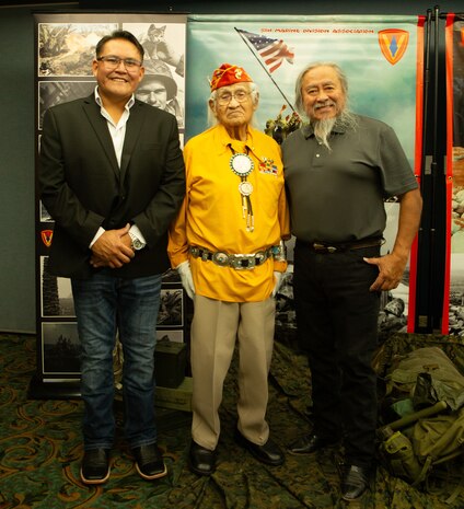 Navajo Code Talker Thomas Begay poses with his son and grandson during the 74th annual 5th Marine Division reunion on October 19, 2024 in San Antonio, Texas. Mr. Begay is one of two remaining original Navajo Code Talkers that served during World War II. He was joined by many other WWII and Vietnam veterans at their annual reunion honoring all Marines who served under 5th MARDIV. (U.S. Marine Corps Photo by Staff Sgt. Ryanne Williams)
