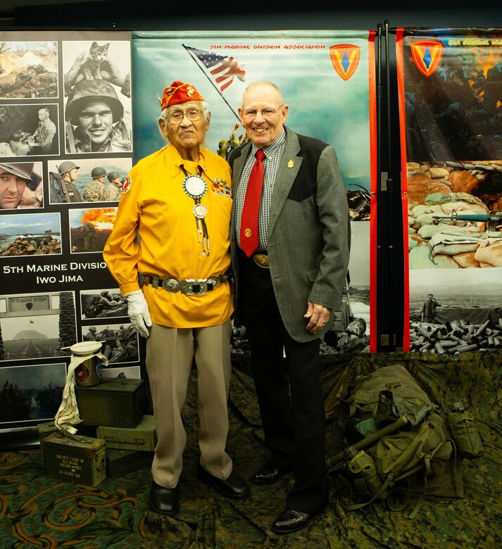 Navajo Code Talker Thomas Begay poses with the 12th sergeant major of the Marine Corps, retired Sgt. Maj. Harold Overstreet during the 74th annual 5th Marine Division reunion on October 19, 2024 in San Antonio, Texas. Mr. Begay is one of two remaining original Navajo Code Talkers that served during World War II. He was joined by many other WWII and Vietnam veterans at their annual reunion honoring all Marines who served under 5th MARDIV. (U.S. Marine Corps photo by Staff Sgt. Ryanne Williams)
