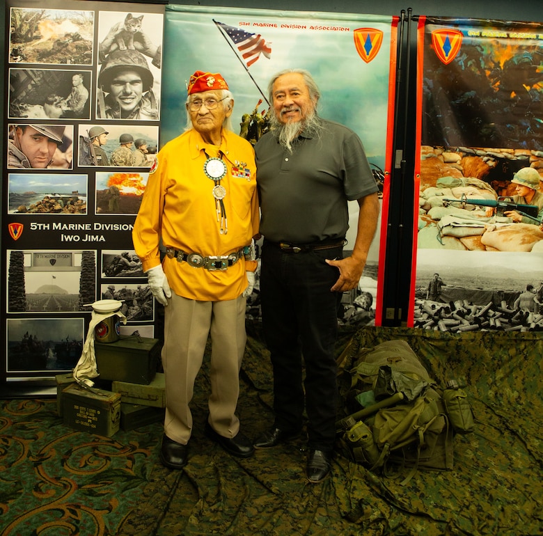 Navajo Code Talker Thomas Begay poses with his son Ronald Begay during the 74th annual 5th Marine Division reunion on October 19, 2024 in San Antonio, Texas. Mr. Begay is one of two remaining original Navajo Code Talkers that served during World War II. He was joined by many other WWII and Vietnam veterans at their annual reunion honoring all Marines who served under 5th MARDIV. (U.S. Marine Corps Photo by Staff Sgt. Ryanne Williams)