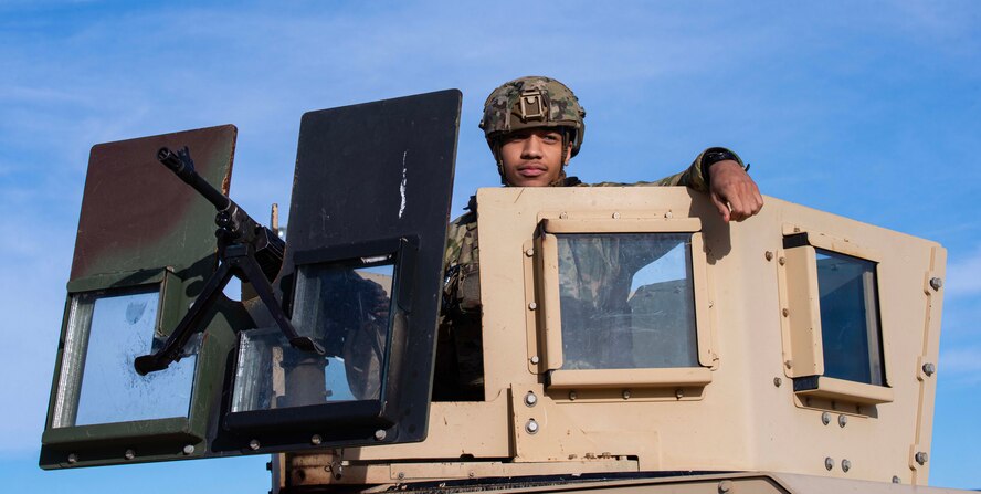 Airman 1st Class Gabriel Holmes, 5th Security Forces Squadron defender, provides overwatch security from a Humvee during Exercise Global Thunder 25 (GT25) at Minot Air Force Base, North Dakota, Oct. 19, 2024. GT25 provides training opportunities for components, units and task forces to deter, defend, and if necessary, defeat, a military attack against the United States and to employ forces as directed. (U.S. Air Force photo by Airman 1st Class Alyssa Bankston)