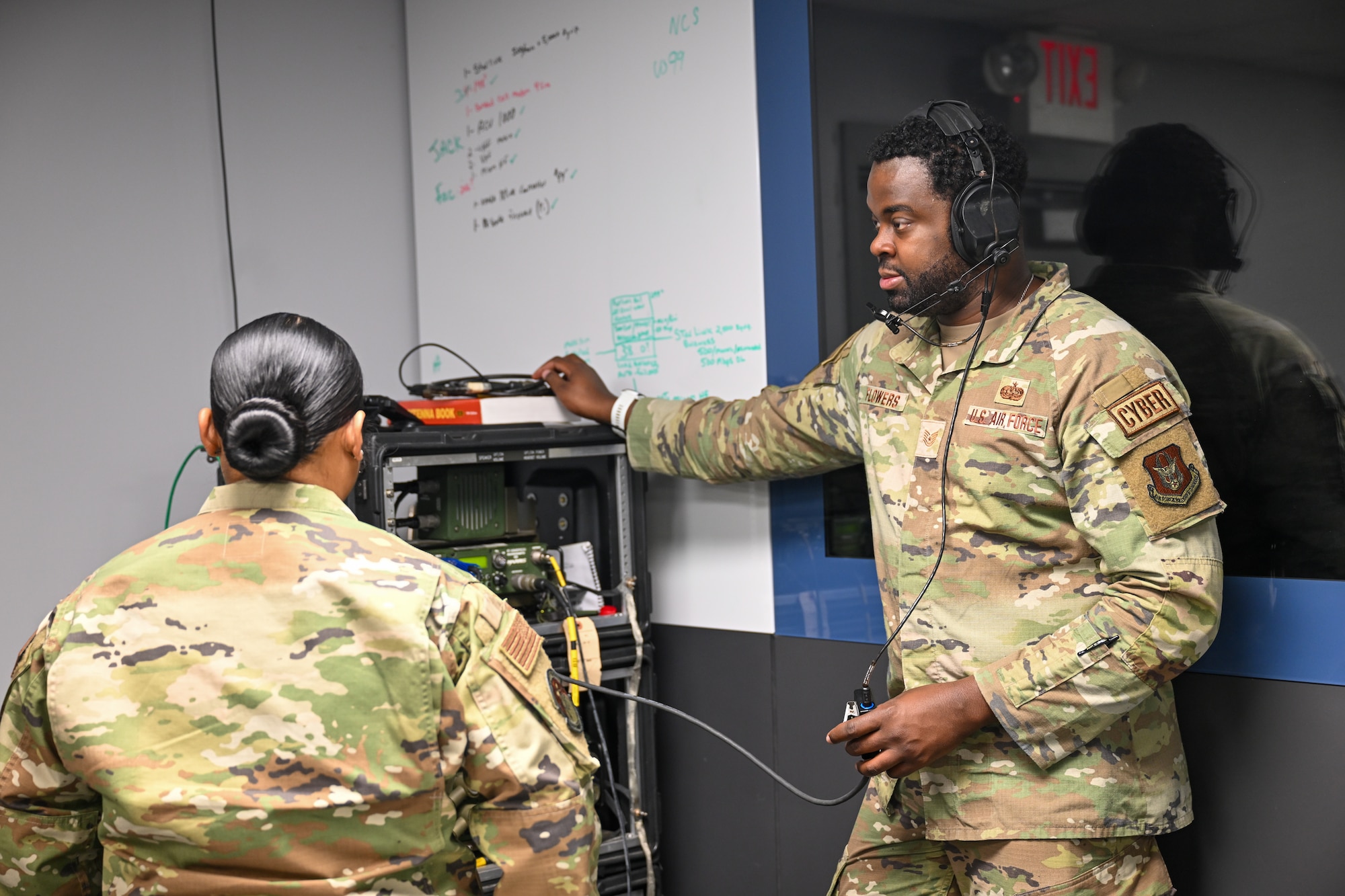 Master Sgt. Michelle Guevarra (left), NCOIC of RF transmission operations, and Tech. Sgt. Malik Flowers (right), RF transmission operations supervisor, both assigned to the 910th Communications Squadron, perform a high-frequency radio system check during Exercise Noble Skywave at Youngstown Air Reserve Station, Ohio, Oct. 25, 2024.